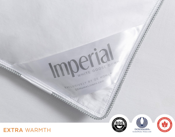 Close-up on the silver corner of our Imperial Hungarian White Goose Down Duvet with "Imperial" written in cursive.