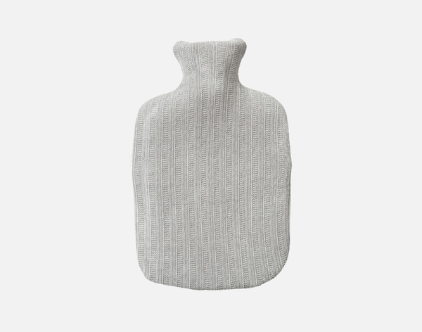 Top view of our Chenille Sherpa Hot Water Bottle in Grey sitting over a solid white background.