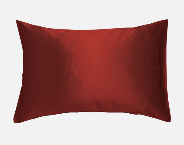 Our Mulberry Silk Pillowcase in Ruby Red sitting against a solid white background.