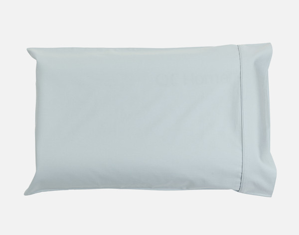 Our Petite Bamboo Cotton Pillowcase in Sky Blue sitting against a solid white background.