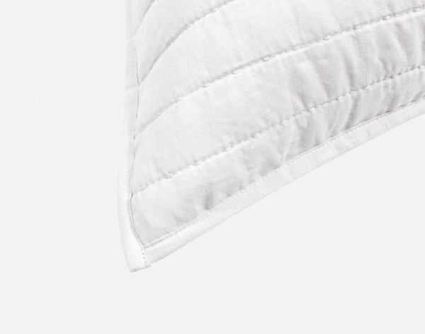 Close-up on the light flanged edge on the corner of our Linen Cotton Euro Sham in White.