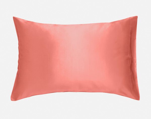 Our Mulberry Silk Pillowcase in Flamingo sitting against a solid white background.