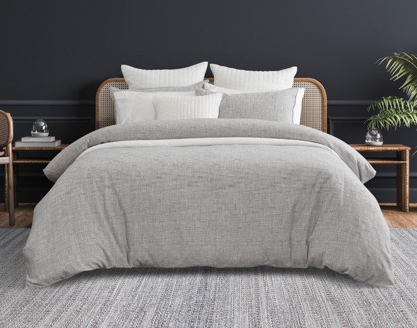 Front view of our Landon Duvet Cover dressed over a queen bed in a dark grey bedroom.