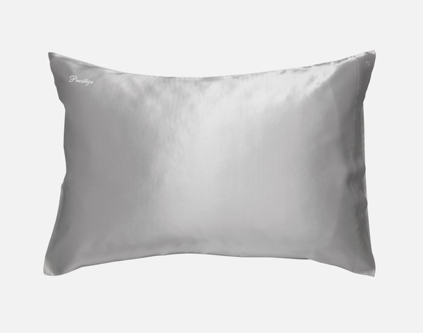 Front view of our Silver Mulberry Silk Pillowcase, featuring the word "Prestige" embroidered in white thread in our cursive Prestige font in its upper-left corner.