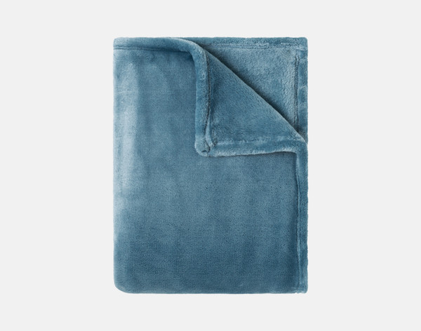 Our Velvet Plush Throw in Teal folded neatly into a tidy square.