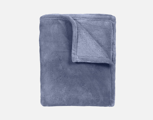 Our Velvet Plush Throw in Bluestone folded neatly into a tidy square.