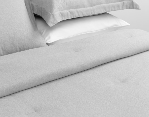 Rolled up top edge on our Heathered Jacquard Comforter Set in Grey folded for a tidy bedroom look.