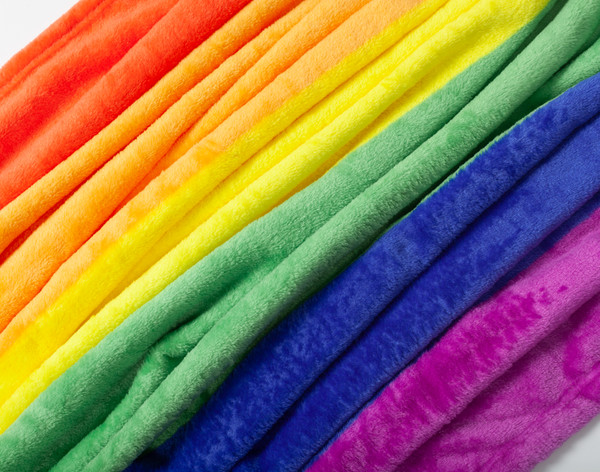 Close-up on our Pride Rainbow Fleece Throw to show its soft fleece surface over each of its six rainbow colours.