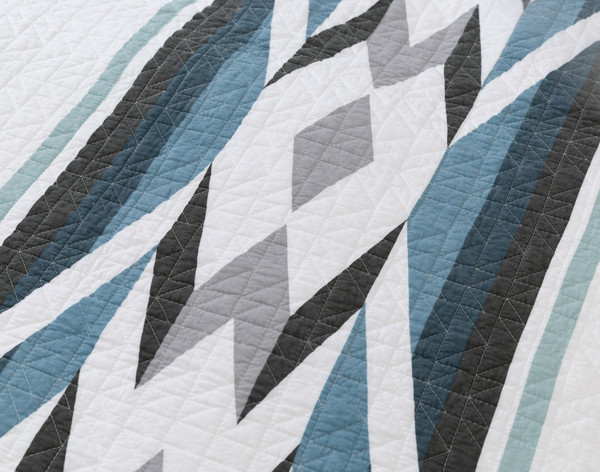 Close-up on one of the diamond designs in a column on our Zima Cotton Quilt Set.