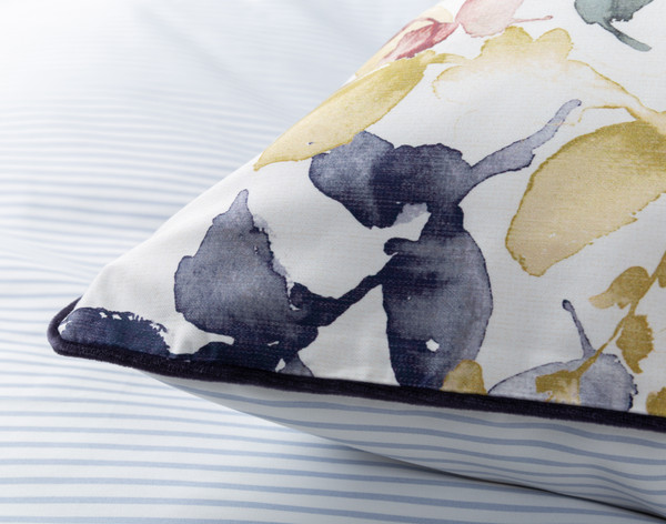 Close-up on the navy piped edge on the corner of our Whim Pillow Sham.