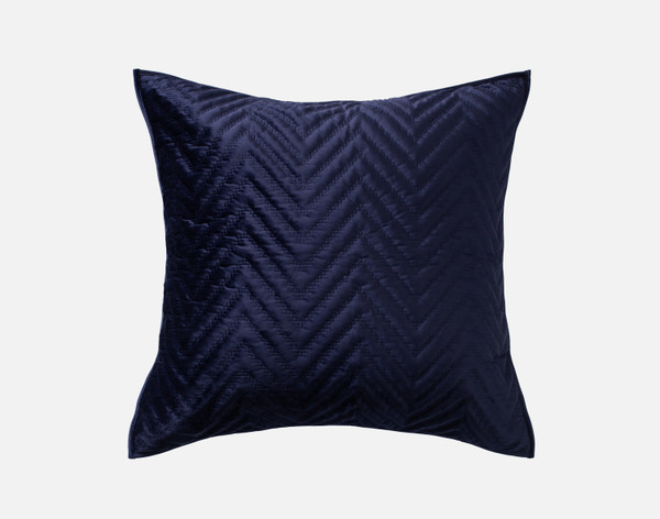 Front view of our Virtuoso Euro Sham featuring a midnight blue surface and quilted chevron design.