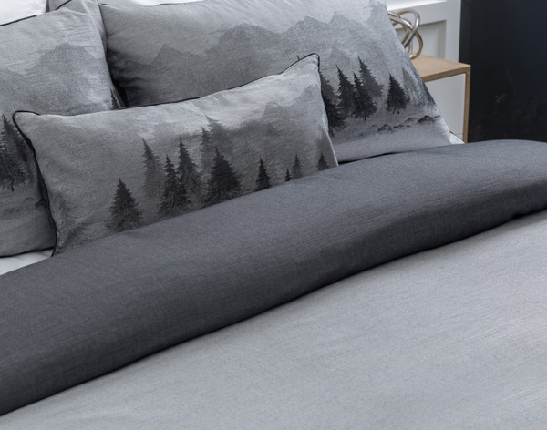 Folded top edge of our Plateau Duvet Cover with coordinating boudoir pillow.