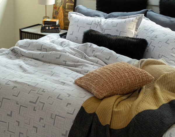 Side view of our Centro Duvet Cover with decorative accessories.