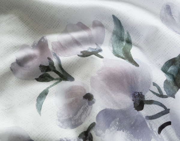 Close-up on the floral peony design on the surface of our Divine Duvet Cover.