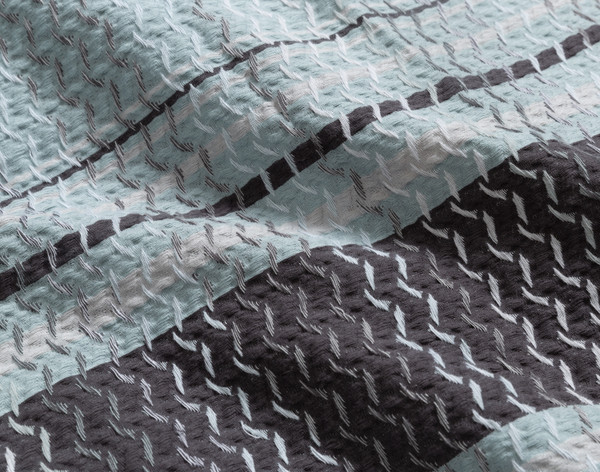Close-up of the striped and zigzag stitched design on the surface of our Vilanova Duvet Cover.