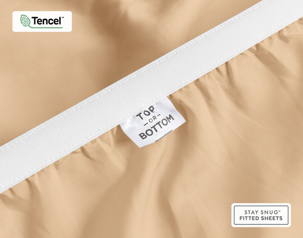 Close-up of Top & Bottom tag on the elastic of our BeechBliss TENCEL™ Modal Fitted Sheet in Cashew.