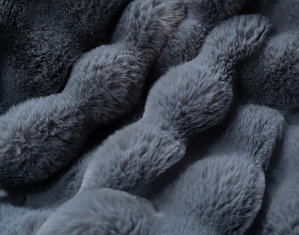 Close-up on the textural surface on our Bubble Faux Fur Throw in Shale.