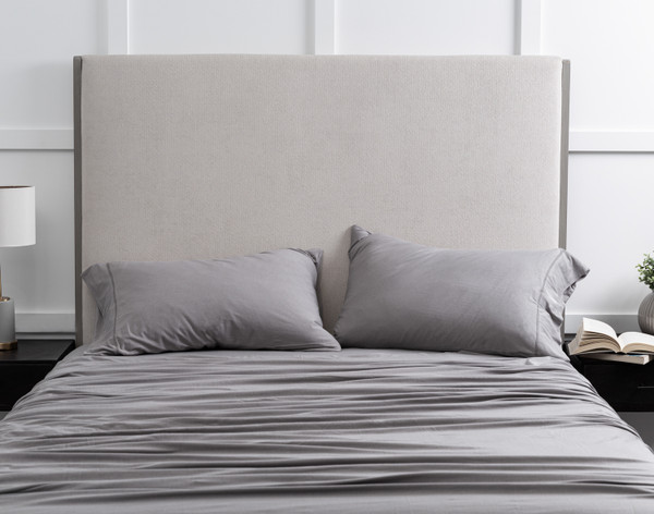 Front view of our Bamboo Cotton Jersey Sheet Set in Grey dressed over a queen bed in a white bedroom.