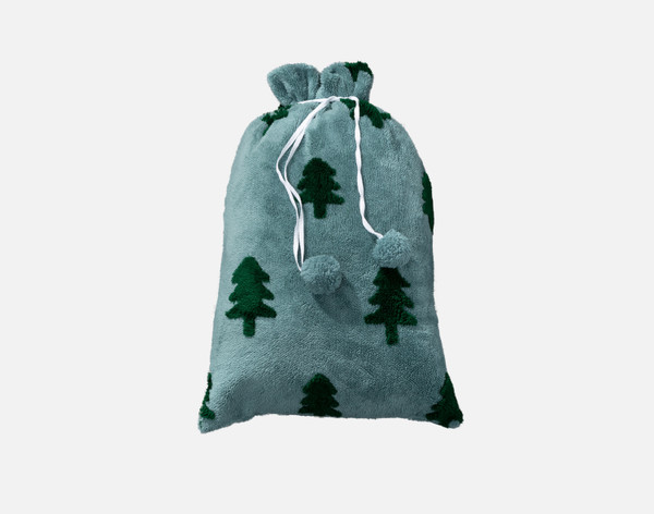 Our packaging for our Carved Holiday Throw in Treetime to show it in a coordinating fleece bag.