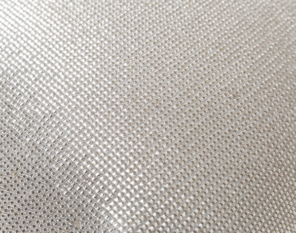 Close-up on the shimmering surface of our Beaded Square Cushion Cover in Silver.