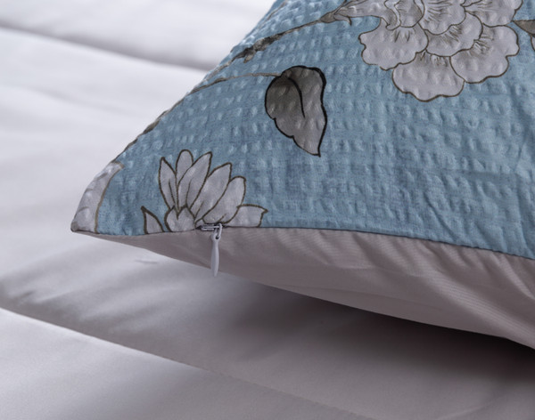 Close-up on the corner and zipper enclosure of a coordinating pillow sham from our Jules Comforter Set.