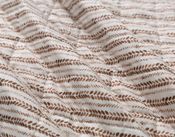 Close-up on the reverse pattern on our Selva Coverlet Set.