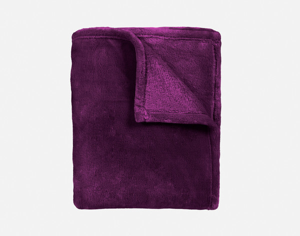 Our Velvet Plush Throw in Purple folded neatly into a tidy square.