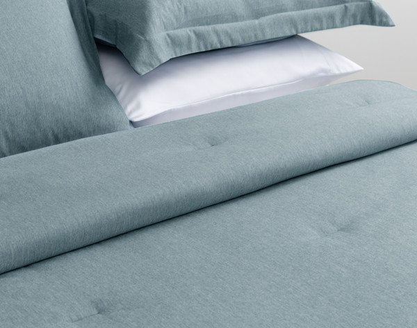 Ruffled fabric on our Heathered Jacquard Comforter Set in Teal Green to show its soft surface.