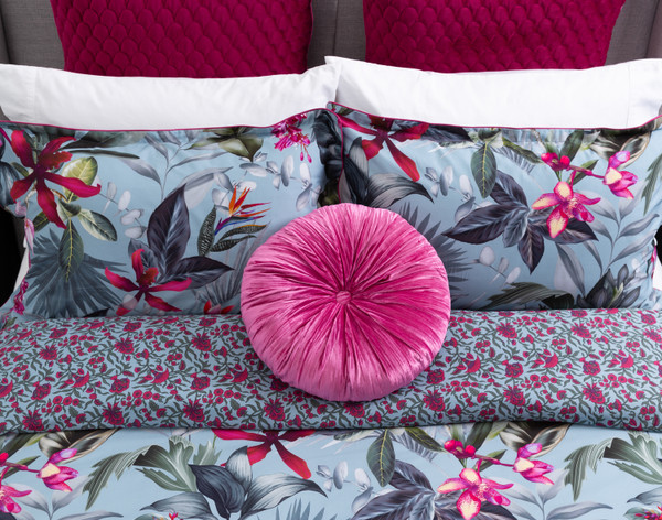 Top view of our Sulani Round Cushion resting on its coordinating duvet cover.