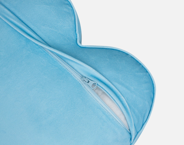 Close-up on the fold and zipper enclosure on the back of our You + Me Candy Heart Cushion.