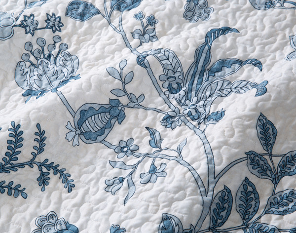 Close-up on the winding botanicals on the surface of our Florentine Recycled Polyester Coverlet Set.