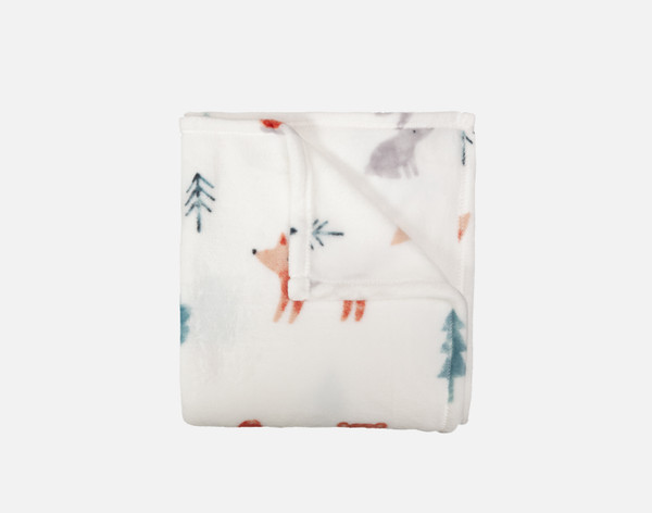 Close-up of our Reddy Fox Kids' Fleece Velveteen Throw folded into a tidy square.