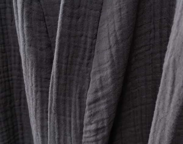 Closer view of the subtle grid texture and soft cotton fabric on the surface of our Muslin Gauze Bathrobe in Charcoal.