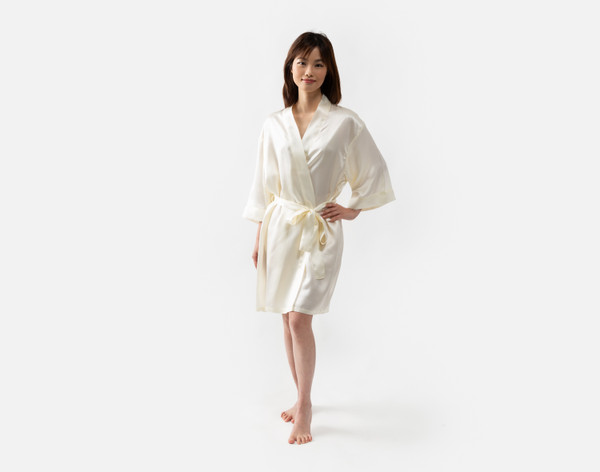 Our Snow Silk Kimono Robe being worn by a young woman with a slim build.
