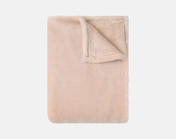 Our Velvet Plush Throw in Rose folded neatly into a tidy square.