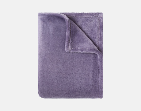 Our Velvet Plush Throw in Mulberry folded neatly into a tidy square.