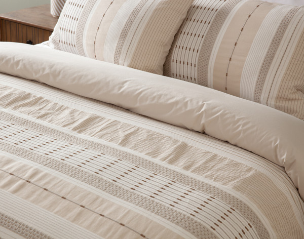 Close up of our Adrift collection dressing the head of a bed.