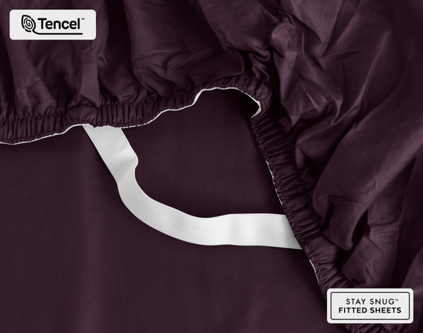 Close-up on the elastic snug fit band on the corner of our Eucalyptus Luxe TENCEL™ Lyocell Fitted Sheet in Purple.