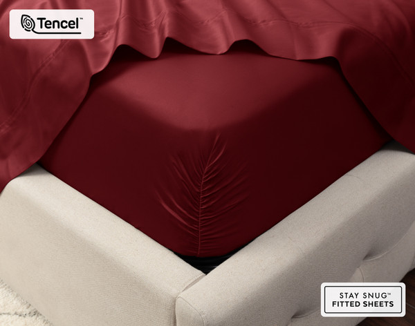 Close-up on the corner of a mattress with our Eucalyptus Luxe TENCEL™ Lyocell Fitted Sheet in Black Cherry to show its snug fit.
