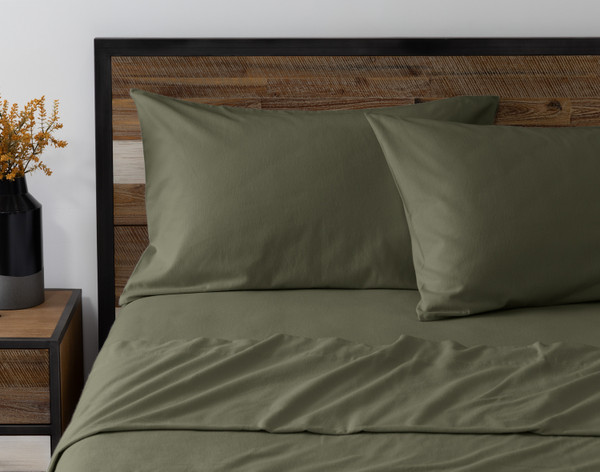 Front view of two pillowcases from our Pinetree Flannel Sheet Set leaning against a headboard.
