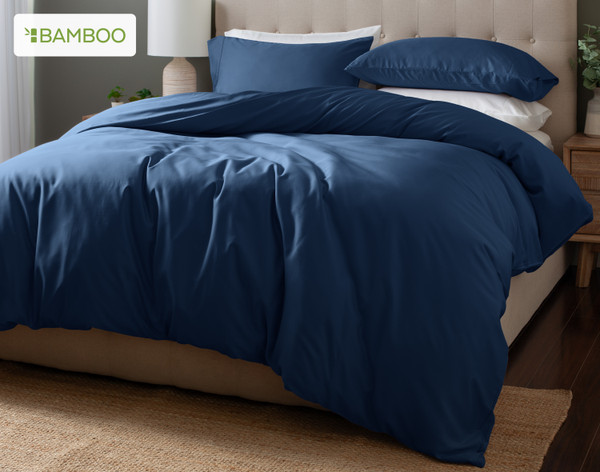 Angled view of our Bluewater Bamboo Moon Duvet Cover Set dressed over a plain bed.