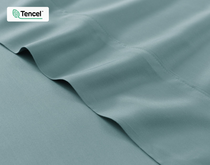 Close-up on the fitted and flat sheet of our BeechBliss TENCEL™ Modal Sheet Set in Tidewater Blue to show its silky soft surface.