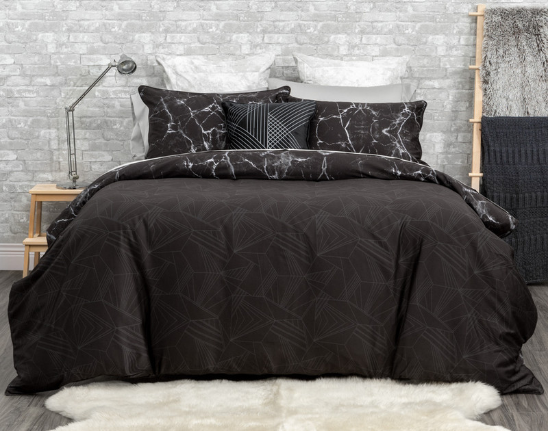Inkstone Duvet Cover reverses to a silver geometric print on a black background.