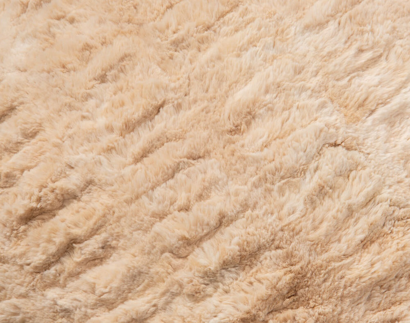 Carved Faux Fur Euro Sham in Caramel, a medium beige with orange undertones, texture close-up
