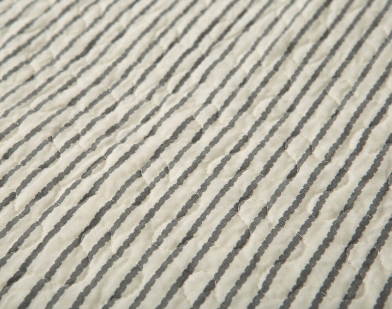 Reverse thin blue stripe pattern on our Purcell Cotton Quilt Set.