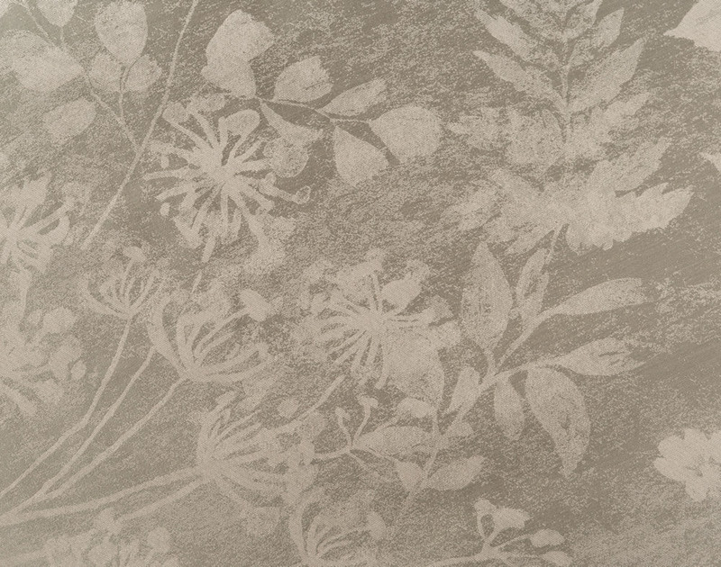 Close-up of Vale Green Duvet Cover pattern, featuring pale botanicals on a pale stonewood background.