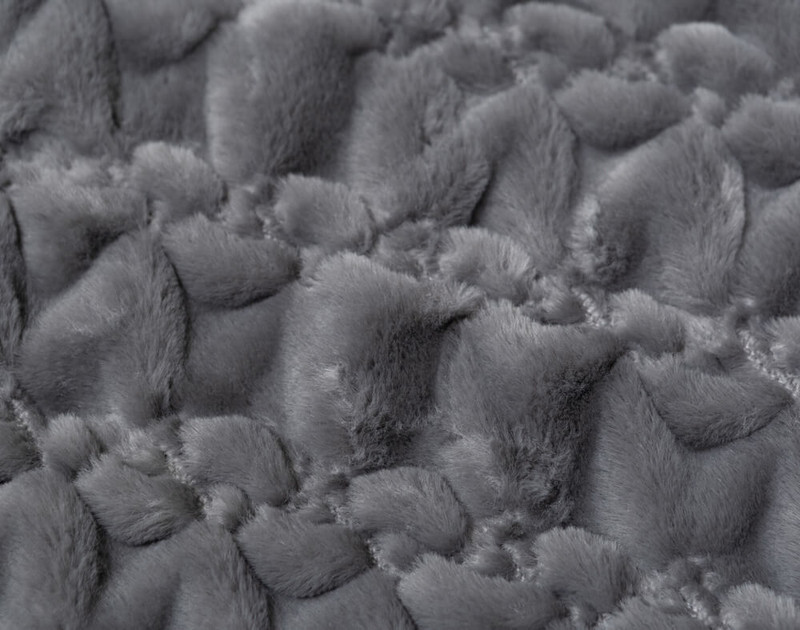 Close-up of the textured pattern on our Carved Faux Fur Throw in Graphite Grey.