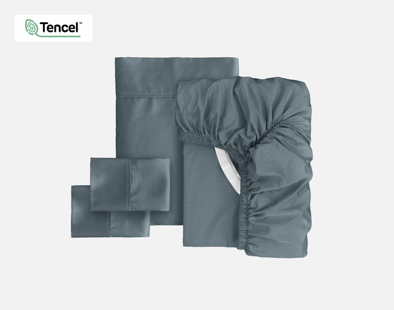 Front view of all the pieces from our Eucalyptus Luxe TENCEL™ Lyocell Sheet Set in Thundercloud folded into compact squares.