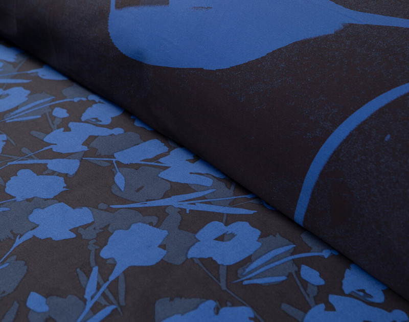 Close-up on our deep navy and black reverse of our Frolic Floral Duvet Cover.
