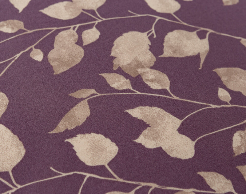 Close-up of our Fiona Floral Bedding Collection reverse to show its neutral leaf pattern and purple background.